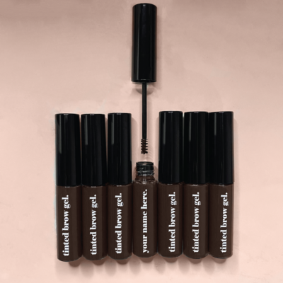 Tinted brow gel product in sleek, professional packaging.