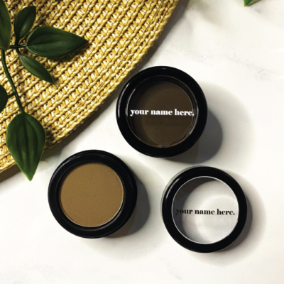 Display of premium eyebrow products with labels highlighting features like paraben-free and natural ingredients.